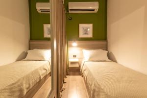 Postel nebo postele na pokoji v ubytování Oda Hotel Tirana