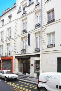 a white van parked in front of a building at Villa Des Princes in Paris