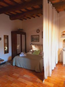 Voodi või voodid majutusasutuse La Tana del Riccio toas