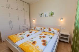 เตียงในห้องที่ Villa Lilli - Appartements Kroatien