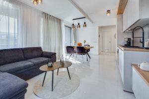 a living room with a couch and a table at Diamond two bedroom apartment in Zadar