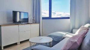 TV a/nebo společenská místnost v ubytování Estudio Infinity con parking