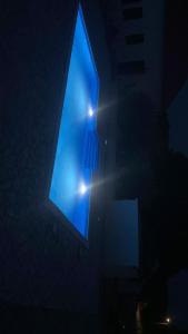 a building with a blue window in the dark at Kuća za odmor Mira blizu Biograda na moru in Donja Jagodnja +31 photos