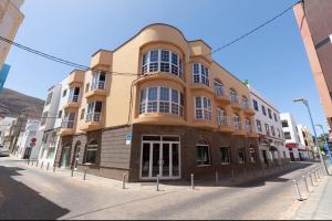 a building on the side of a street at Itan home in Gran Tarajal