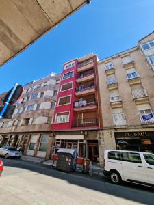 a white van parked in front of a building at Apartamento ideal Florida in Vitoria-Gasteiz