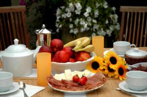 a table with a bowl of fruit and a plate of food at Antico Camino B&B in Muro Leccese +14 photos