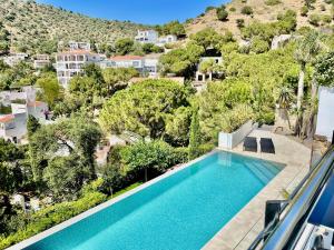 an aerial view of a swimming pool in a villa at CASTELL BLAU in Roses