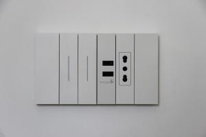 a white light switch on a white wall at Villa Ettore in Pompei