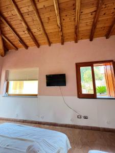 Posteľ alebo postele v izbe v ubytovaní Studio with shared pool enclosed garden and wifi at Trecastagni 8 km away from the beach