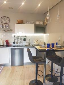 a kitchen with a table and chairs in a room at Centro Loft 2.0 in Oviedo