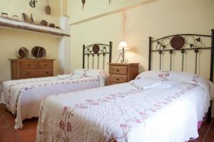 Łóżko lub łóżka w pokoju w obiekcie vivienda turistica Fuente Zagrilla II