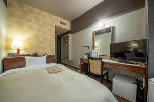 Postel nebo postele na pokoji v ubytování Hotel New Carina