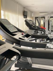 a row of treadmill machines in a gym at Casa Francisco in Cuernavaca