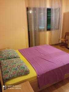 Postel nebo postele na pokoji v ubytování Apartment Antonija