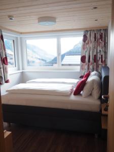 Llit o llits en una habitació de Bergzeit Appartements