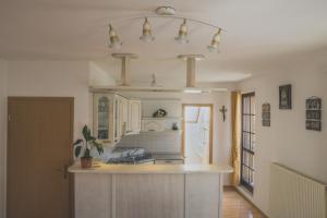 a kitchen with a sink and a counter top at Apartment Amak with free onsite parking in Bovec