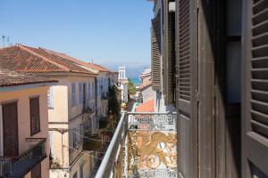 a view from a balcony of a city with buildings at Aion Luxury Hotel in Nafplio