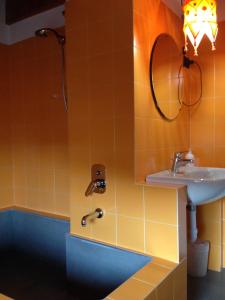 a bathroom with a sink and a mirror at La Corte del Noce in Zanica +24 photos