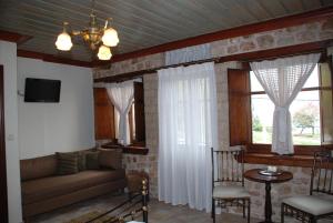 a living room with a couch and a window at Siarava in Ioannina