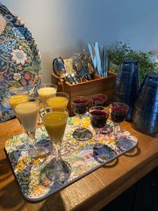 a tray of wine glasses sitting on a table at Eleonora Bed & Breakfast in Kristiinankaupunki