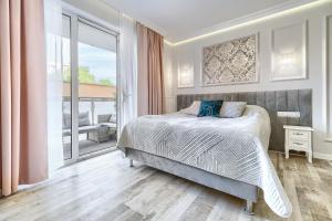 מיטה או מיטות בחדר ב-Silver Apartments