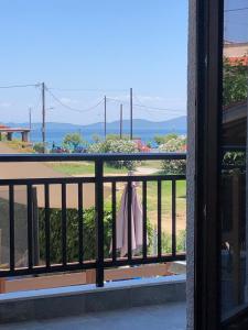 a view of the ocean from a balcony at Seaside Christina Apartments in Ierissos