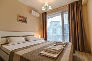 Postel nebo postele na pokoji v ubytování Apart-Hotel Onegin & Thermal Zone