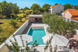 an overhead view of a swimming pool in a house at Villa Pacis in Benkovac