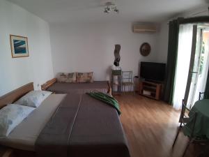 Posteľ alebo postele v izbe v ubytovaní Apartments Andabaka