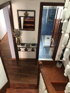 a stairway with a shower and a mirror at CASA LUPITA in Cudillero +19 photos
