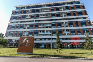a building with a akyl sign in front of it at Apartment Atrium- A blok in Novi Beograd