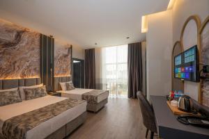 Cama ou camas em um quarto em World Class Hotel - Istanbul Airport mais 37 fotos
