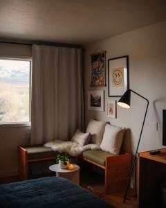 a living room with a couch and a window at Apres Whitefish in Whitefish