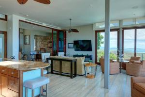 a kitchen and living room with a view at Happy Days Villa A in Fajardo