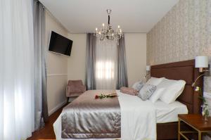 Letto o letti in una camera di Rooms Valery