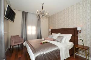 Letto o letti in una camera di Rooms Valery