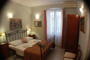 a bedroom with a bed and a window at Adagio Theatre Apartment Split in Split