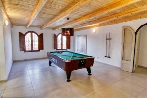 a pool table in a room with a ceiling at Villa Carlos in Vinarós