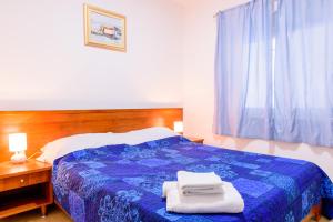 Postel nebo postele na pokoji v ubytování Apartman Lu