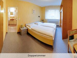 Giường trong phòng chung tại Hotel Keinath Stuttgart