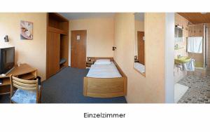 Giường trong phòng chung tại Hotel Keinath Stuttgart