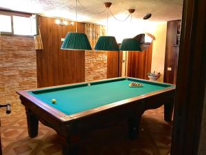 a pool table in a living room with at Casa Vacanze Neri in Scandicci