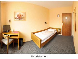 מיטה או מיטות בחדר ב-Hotel Keinath Stuttgart