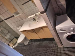 a bathroom with a sink and a washing machine at Gabriel's Home in Stavanger +38 photos
