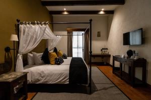 Postel nebo postele na pokoji v ubytování Hacienda El Salitre Hotel & Spa