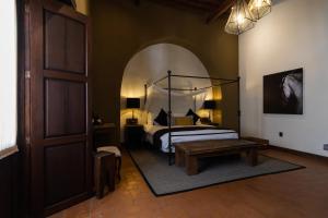 Postel nebo postele na pokoji v ubytování Hacienda El Salitre Hotel & Spa