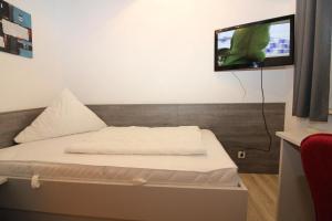 Postel nebo postele na pokoji v ubytování HP Touristik - Seepark Burhave 6
