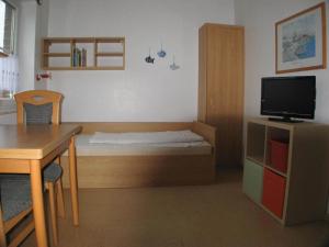 Postel nebo postele na pokoji v ubytování HP Touristik - Seepark Burhave 6