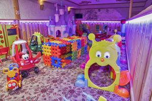 a childs play room with toys and a castle at Hotel Toporów in Białka Tatrzanska