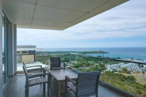 a dining room with a view of the ocean at Happy Days Villa B in Fajardo +35 photos